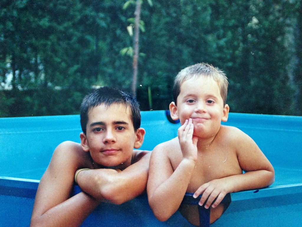 The two brothers who made MadiCam, as kids, in a swimming pool.